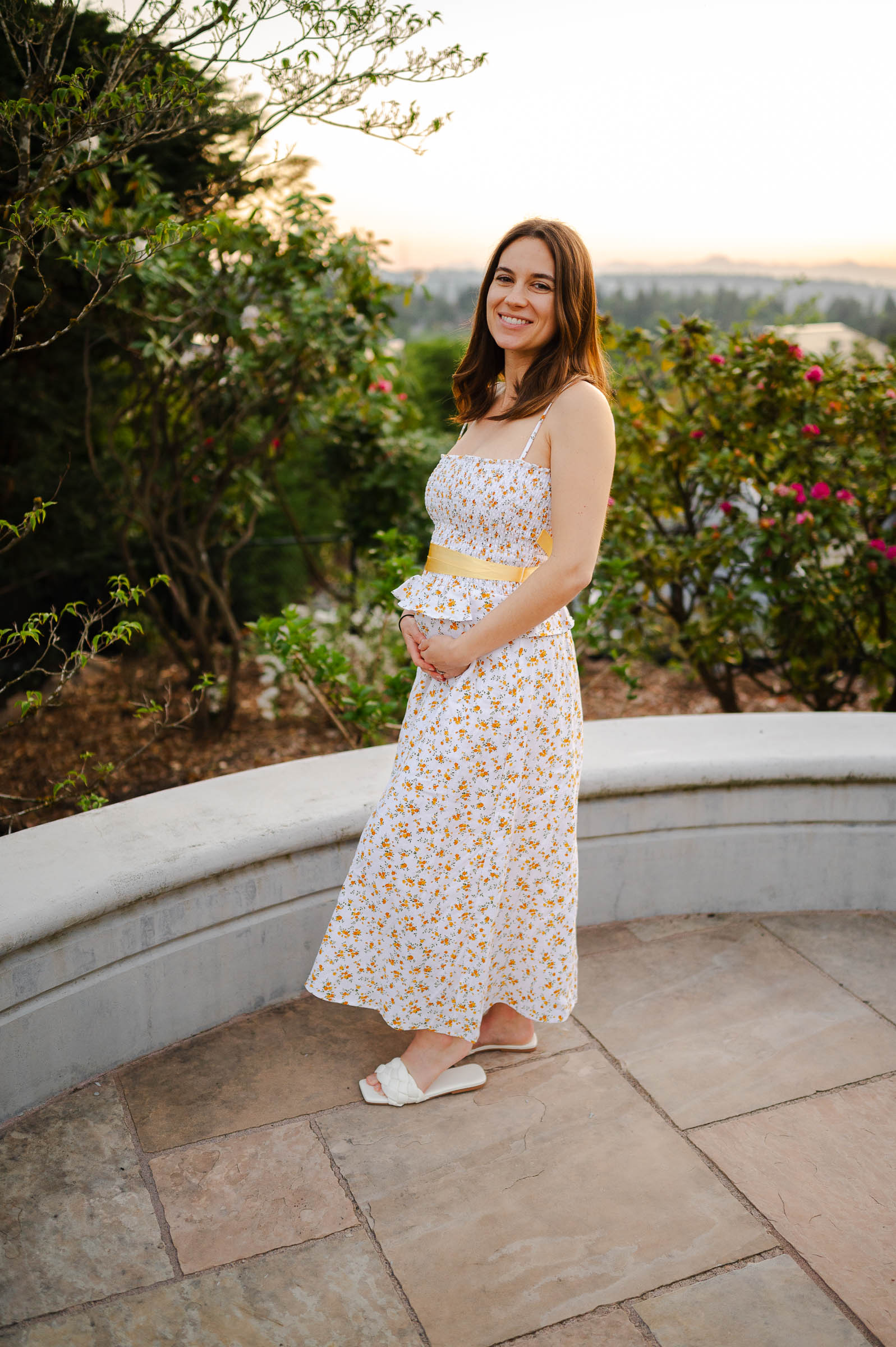 beautiful young mum to be in the in her garden